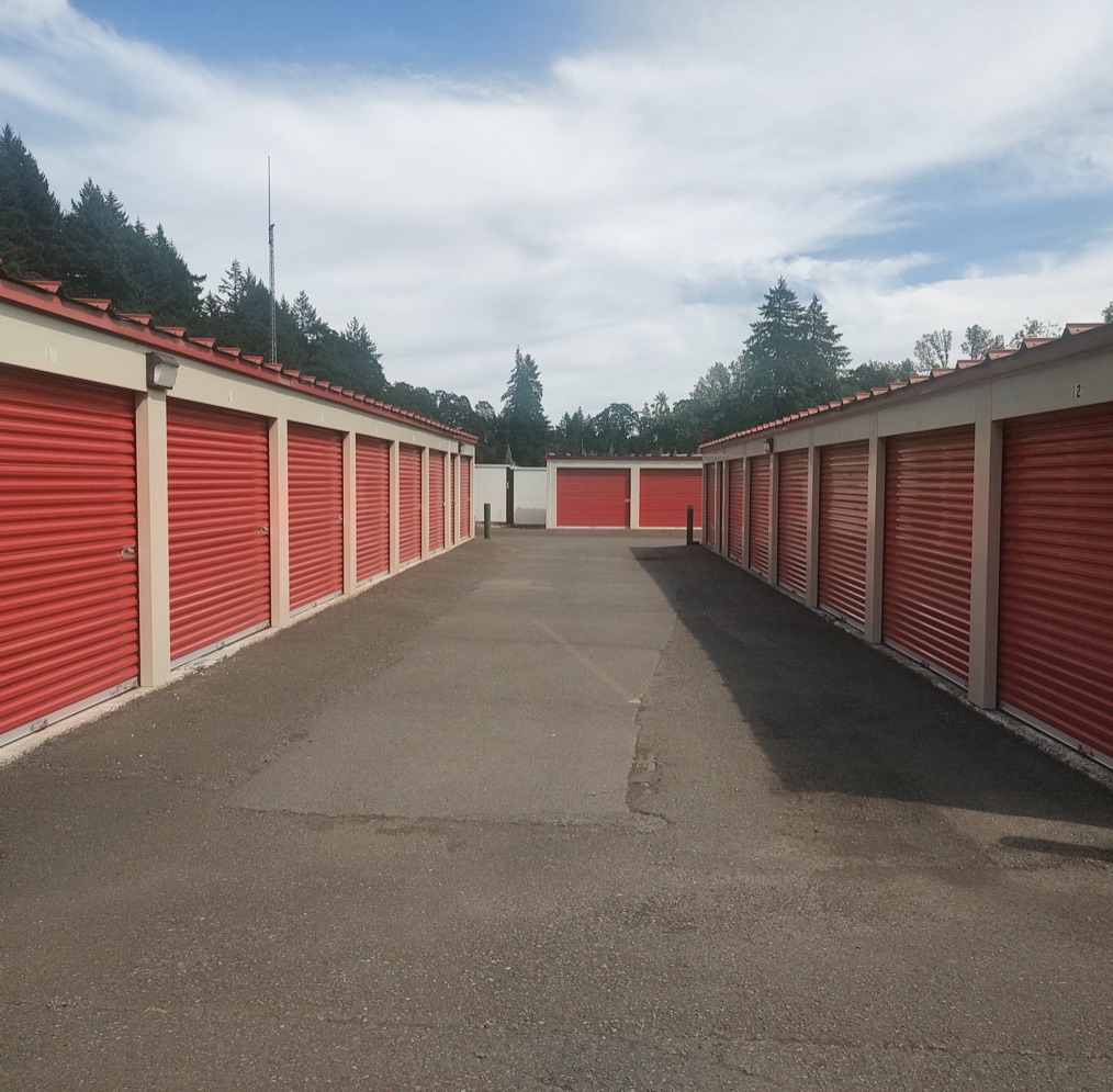 A row of red roll-up storage unit doors at Hope Valley Resort Self Storage.
